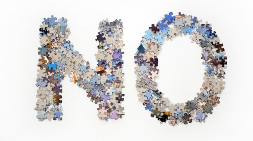 The word no made from jigsaw puzzle pieces
