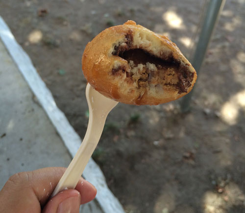 Cookie Dough Me Deep Fried Peanut Butter Cup. Cookie Dough Me's set-up is impressively locked down. They've already got piles of deep fried things — Oreos, cookie dough bits, peanut butter cups — on the ready in hot trays, looking to all the world like a series of trays of Chinese chicken balls. Except, instead of micro-squares of chicken surrounded by tasty batter, these have chocolate goodness. The peanut butter cup was surprisingly delicate, all things considered. Though it's butter cuppiness did get diminished somewhat by the deep frying. 7/10